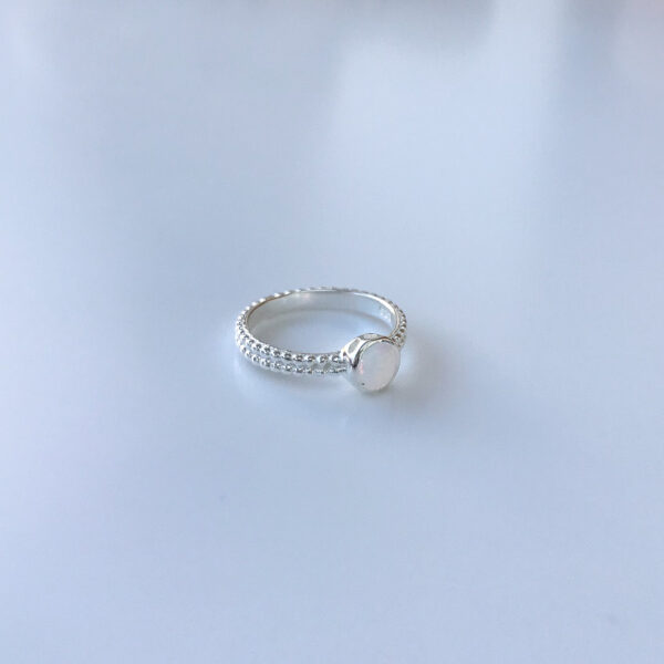 Created white opal ring