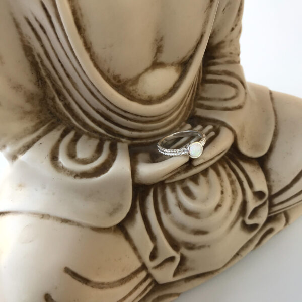 Created white opal ring on buddha