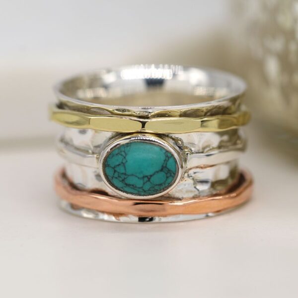 Turquoise sterling silver spinning ring with copper:brass rings Wildwood Cornwall