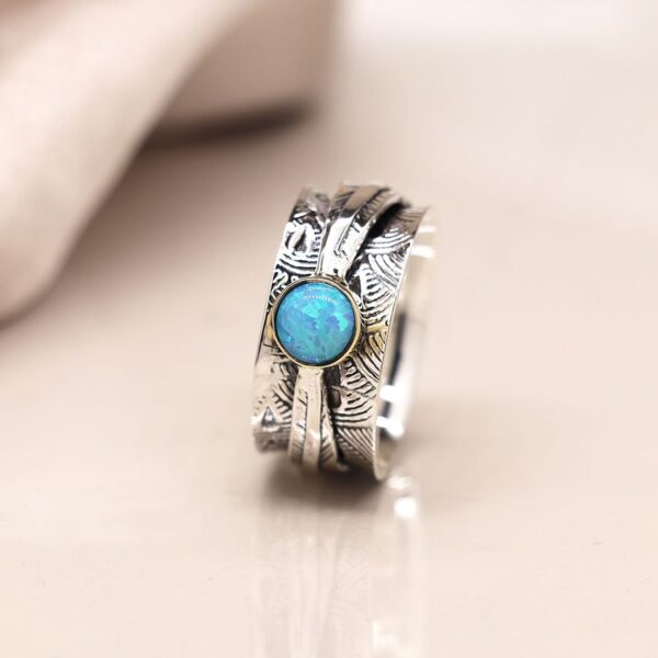sterling silver leaf embossed spinning ring with opal